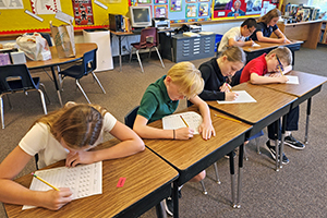 Middle School students practice penmanship.