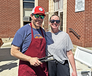 Parents serve food at the Spring Carnival.